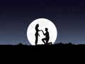 silhouette of a man kneeling to a woman on top of a mountain with the moon and blue sky as a background Royalty Free Stock Photo