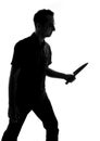 Silhouette of a man with knife Royalty Free Stock Photo