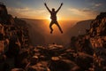 Silhouette of man leaping over chasm, symbolizing lifes triumph at sunrise Royalty Free Stock Photo