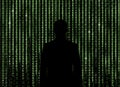 Silhouette of man looking through the matrix background
