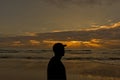 Silhouette of a man looking at the nice sunrise