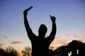 Silhouette of man making a selfie with the golden sun raising his thumb up. peaceful view Royalty Free Stock Photo