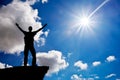 Silhouette of a man on a mountain top. Worship to God. Royalty Free Stock Photo