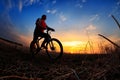 Silhouette of a man on muontain-bike