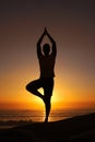 Silhouette, man and namaste with hands for yoga, health and wellness on beach with sunset and zen. Person, shadow and Royalty Free Stock Photo