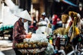 Silhouette of a man in the national Asian hat. Street vendor wit Royalty Free Stock Photo