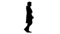 Silhouette Man in old-fashioned laced frock coat and white wig walking in a mannered way looking at camera.