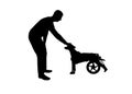 Silhouette Man outdoors strokes his paralyzed dog in a wheelchair.