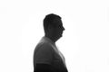 Silhouette of man overweight in profile posing on white background. Close up. place for text