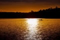 Silhouette of man paddling in kayak with dramatic sunset. Royalty Free Stock Photo