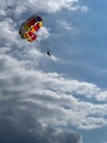 Silhouette of a man parasailing in a blue sky Royalty Free Stock Photo