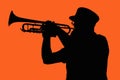 Silhouette of a man playing a brass instrument - trumpet, coronet, bugle, Marching Band