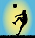 Silhouette of a man playing football