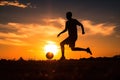 silhouette of a man playing soccer in golden hour, sunset Royalty Free Stock Photo