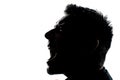 Silhouette man portrait profile screaming angry
