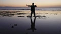 Silhouette man practices qigong exercises, working with qi energy, stand shallow.