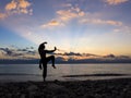 Silhouette of a man practises wing chun on the beach Royalty Free Stock Photo