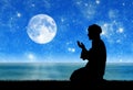 Silhouette of man praying Royalty Free Stock Photo