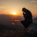 silhouette Man praying at sunset mountains Travel Lifestyle spiritual relaxation emotional meditating concept vacations.