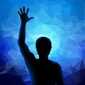 Silhouette of man with raised hand