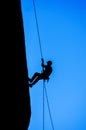 Silhouette of Man Rappelling Royalty Free Stock Photo