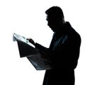 Silhouette man reading newspaper surprised Royalty Free Stock Photo