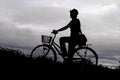 Silhouette of man riding bicycle in countryside, black and white Royalty Free Stock Photo