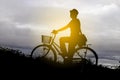 Silhouette Man riding Bicycle at sunset in countryside Royalty Free Stock Photo