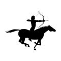 Silhouette of man is riding a horse and aiming from the bow. Royalty Free Stock Photo