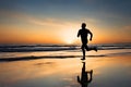 Silhouette of a man running on a beach at sunset. Royalty Free Stock Photo