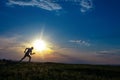 Silhouette man running on meadow Royalty Free Stock Photo