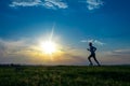 Silhouette man running on meadow Royalty Free Stock Photo