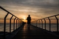 Silhouette of a man running at Pont Del Petroli at sunrise in Barcelona in Spain