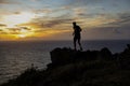 Man running on top of rock at sunrise Royalty Free Stock Photo