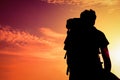 silhouette Man with shoulder bag to look up the sun Royalty Free Stock Photo