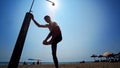 Silhouette man showering his body on beach Royalty Free Stock Photo