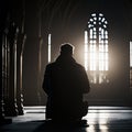 Silhouette of a man sitting on the floor in a church