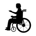 Silhouette man sitting in wheelchair