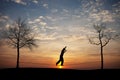 Silhouette of man on slackline Royalty Free Stock Photo