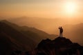 Silhouette Man standing and celebrating success and achievement on the top of mountain with sun rise, for Victory concept. Royalty Free Stock Photo