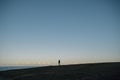 Silhouette of man standing on a lookout with sky and ocean. Alone concept Royalty Free Stock Photo