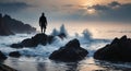 Silhouette of a man standing on the rocks in the sea.