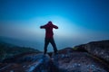 Silhouette man standing into sunset sky