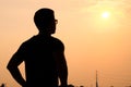 Silhouette of a man with sunglasses standing looking forward Royalty Free Stock Photo