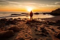 Silhouette of a man at sunset on beach. Royalty Free Stock Photo