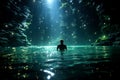 Silhouette of a man swimming in mystery glowing waters of spooky green lake in the night