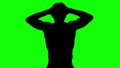 Silhouette of a man tensing arms on green screen