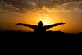 Silhouette of man with their hands in the sunset. Outdoor shot Royalty Free Stock Photo