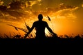 Silhouette of man with their hands in the sunset. Outdoor shot Royalty Free Stock Photo