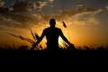Silhouette of man with their hands in the sunset. Outdoor shot Royalty Free Stock Photo